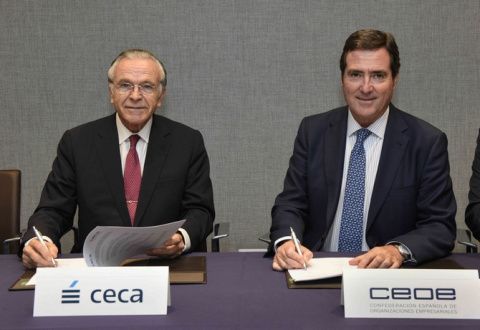 Fain&eacute; y Garamendi firman el acuerdo.